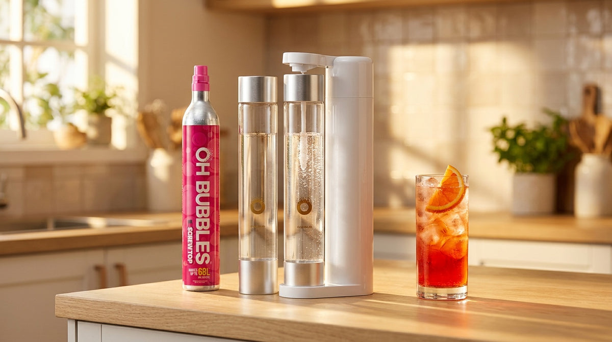 An OH Bubbles cylinder beside a soda maker on a sunlit kitchen bench