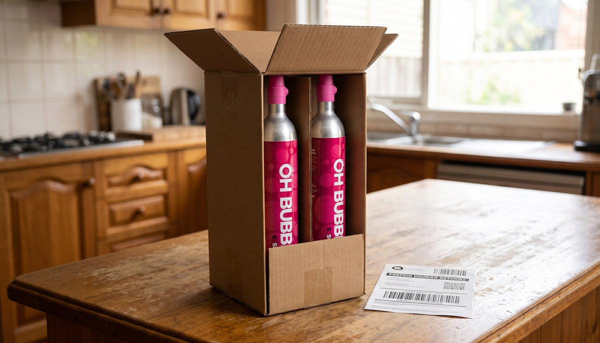 OH Bubbles cylinders in an open kraft box with the courier return label alongside