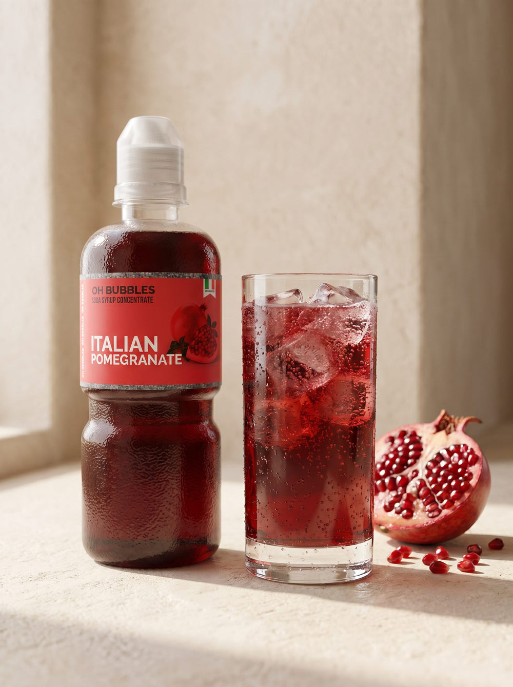 A finished Pomegranate Concentrated Syrup drink over ice, made with real fruit